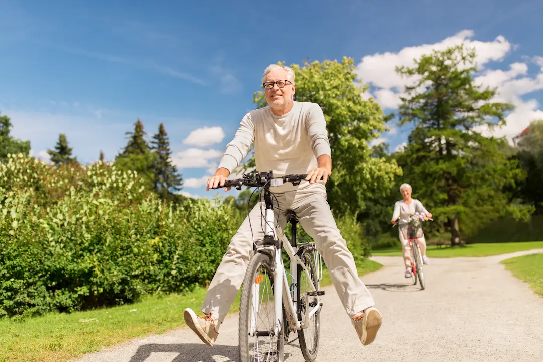 How to Transfer Your UK Pension to Spain: The 2025 Expat Guide How to Transfer Your UK Pension to Spain The 2025 Expat Guide - Happy Retired couple cycling
